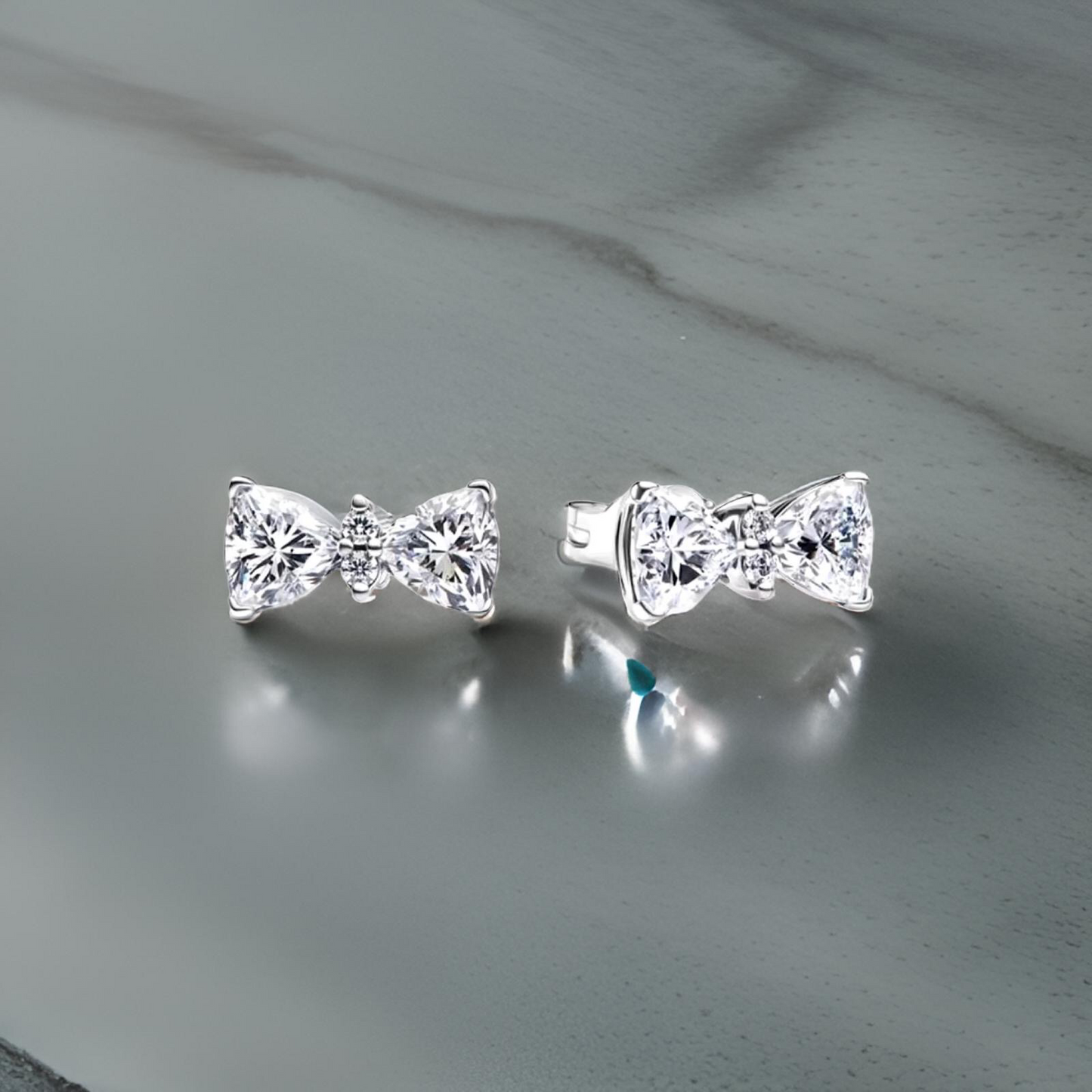 SILVER BOW STUDS